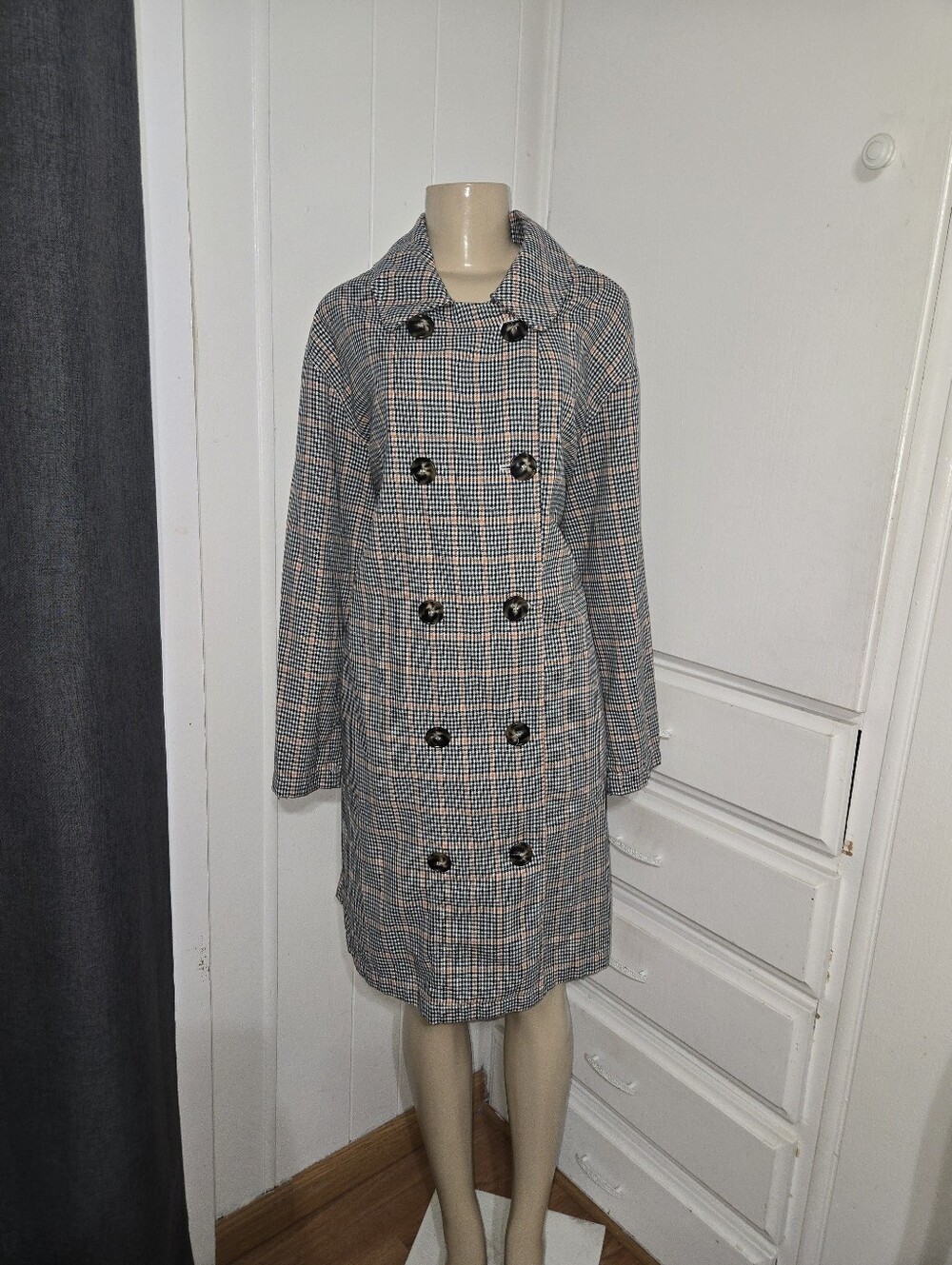 double-breasted plaid Dress coat, stylized with a vintage-inspired silhouette,